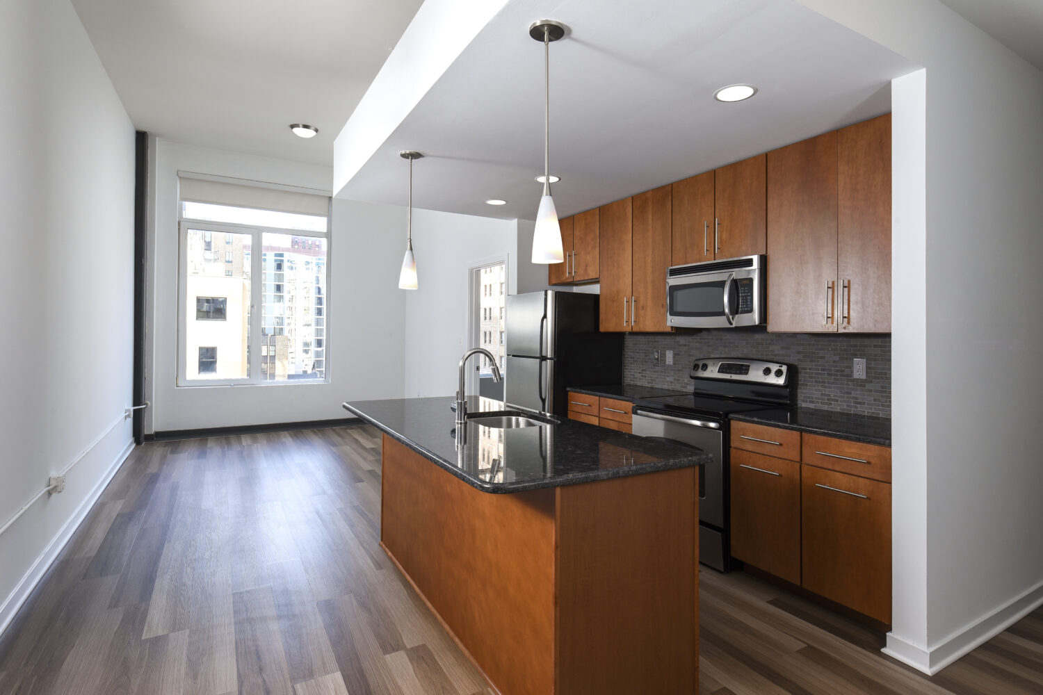 large open kitchen with hardwood floors