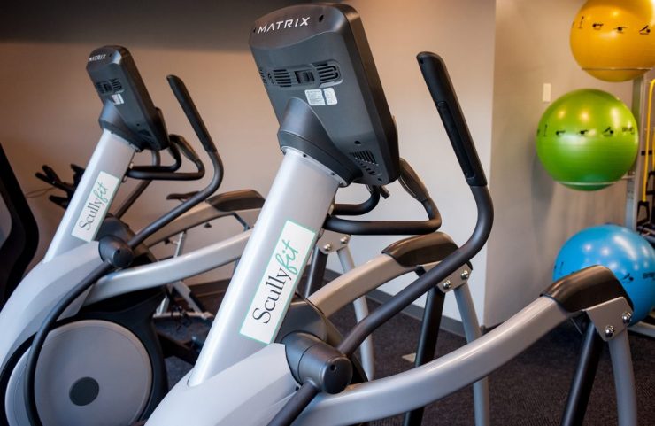 virtual active ellipticals and treadmills in fitness center 