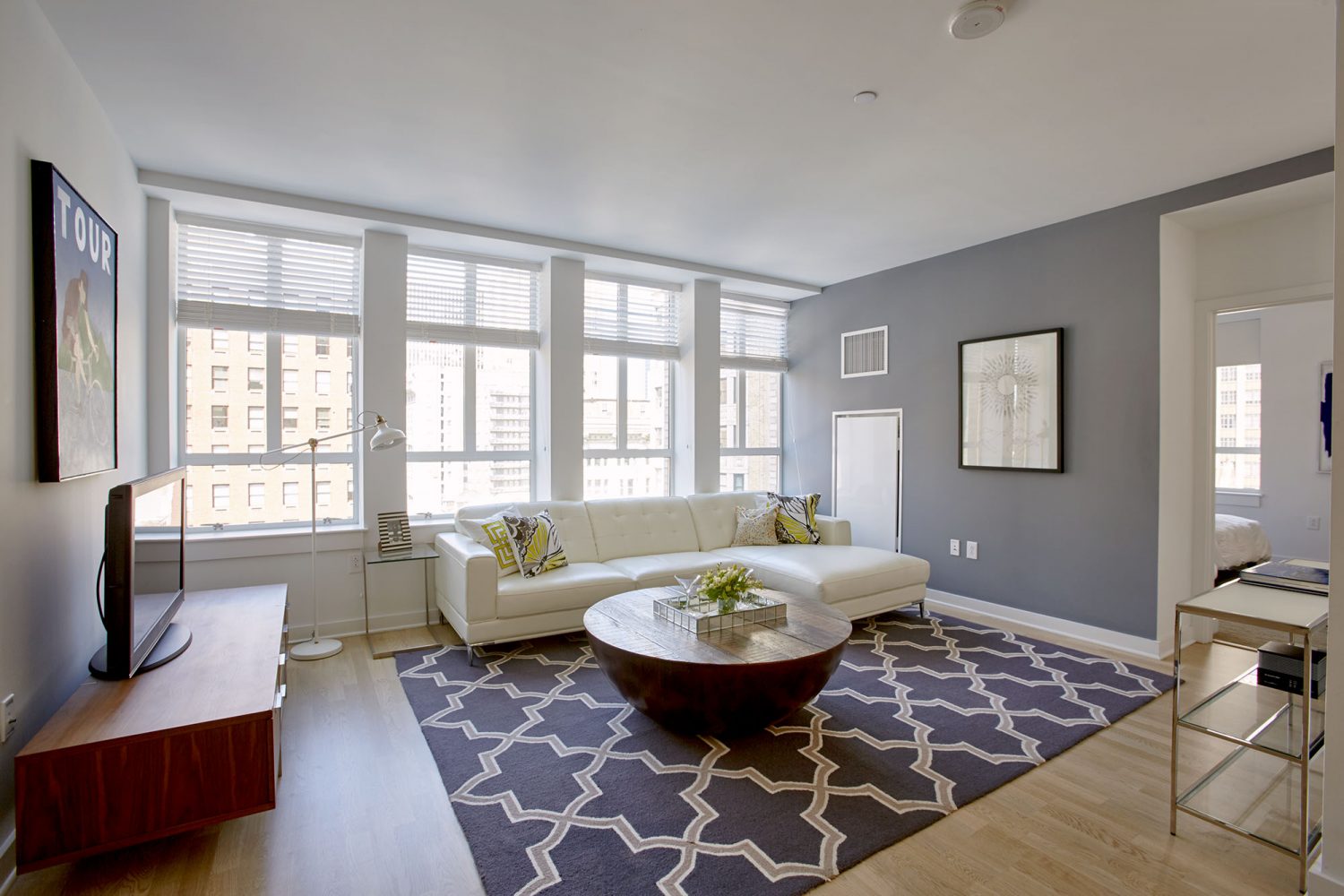 large living room featuring large windows to see the views of Philadelphia