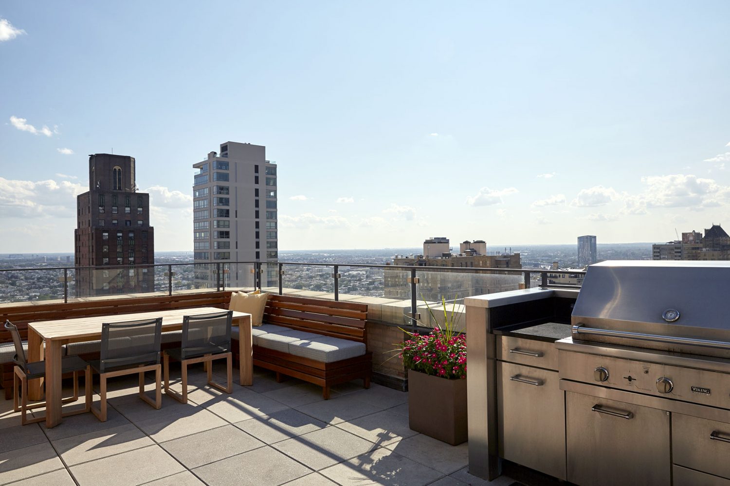 seating area next to stainless steel grills overlooking Philadelphia