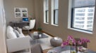 living room with room for a desk and plank wood flooring