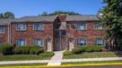 brick exterior with landscaped walkways 