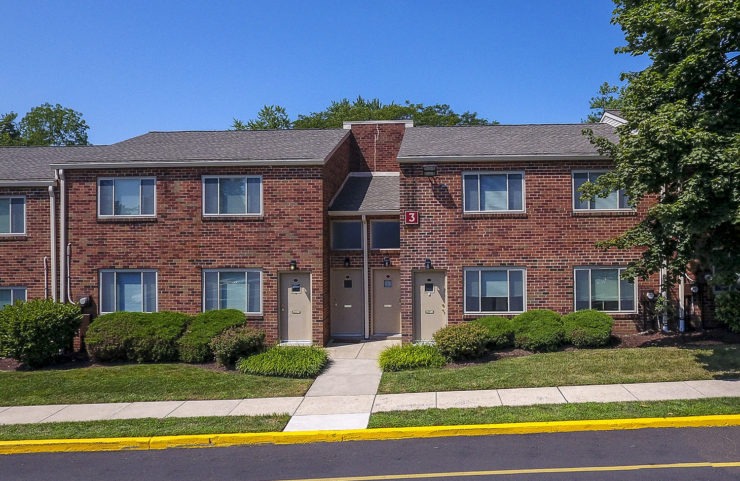 brick exterior with landscaped walkways 