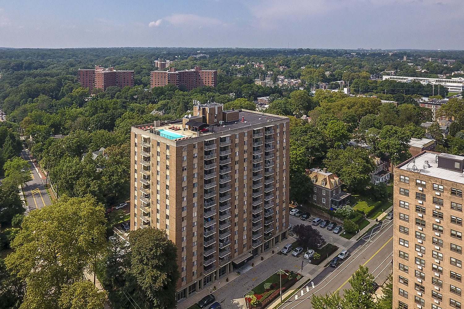 hi-rise building with rooftop pool 