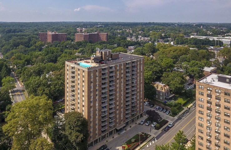 hi-rise building with rooftop pool 