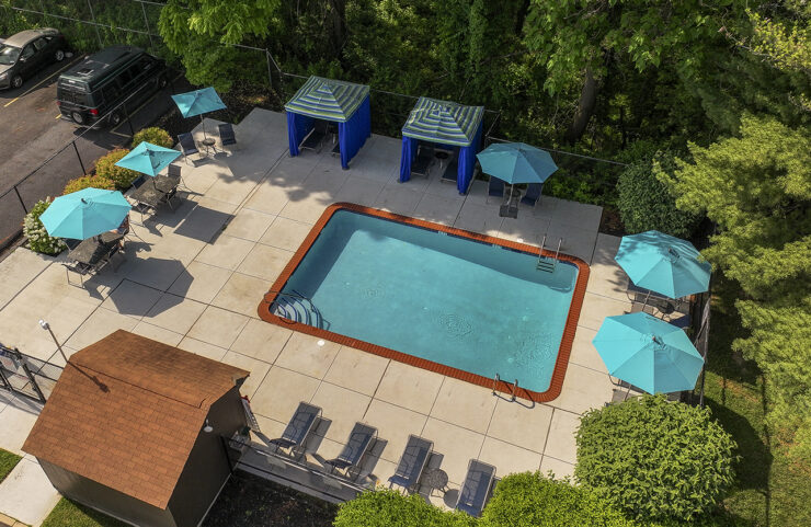 outdoor pool with lounge chairs
