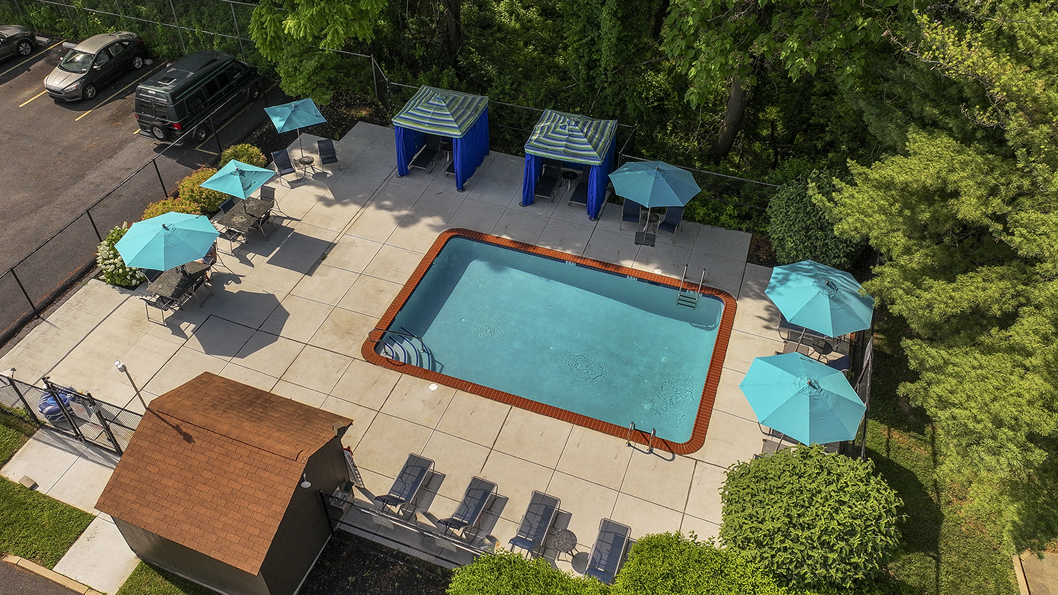 outdoor pool with lounge chairs
