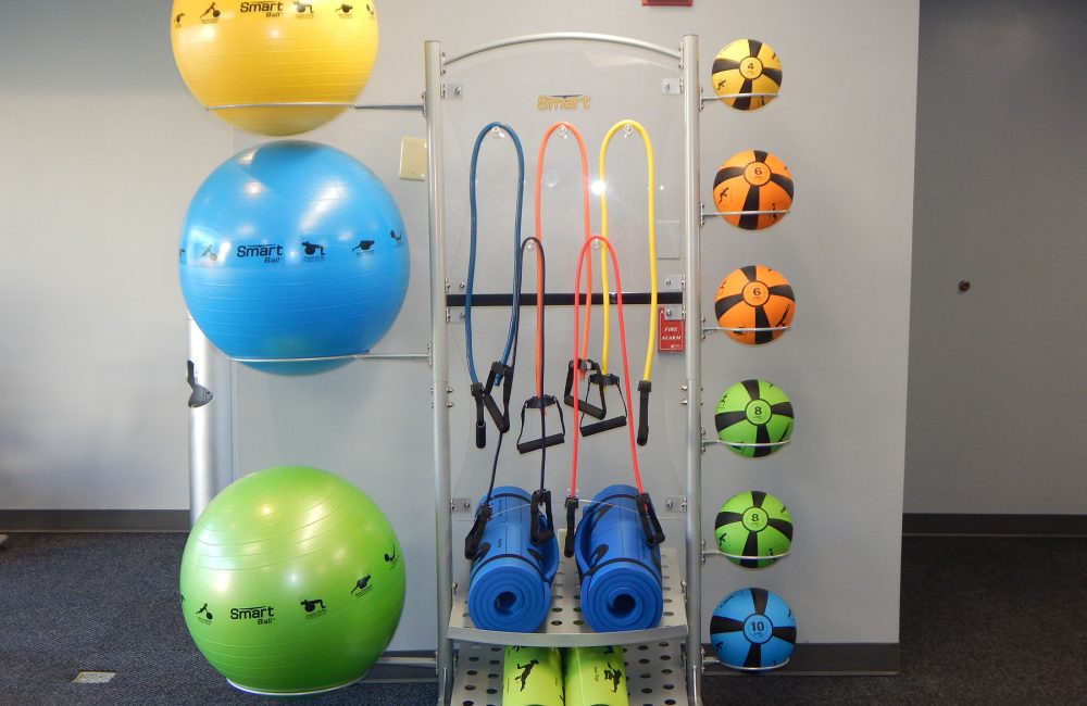 gym equipment including bands, yoga mats and weight balls