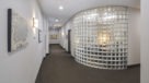 main lobby and leasing office behind glass block wall