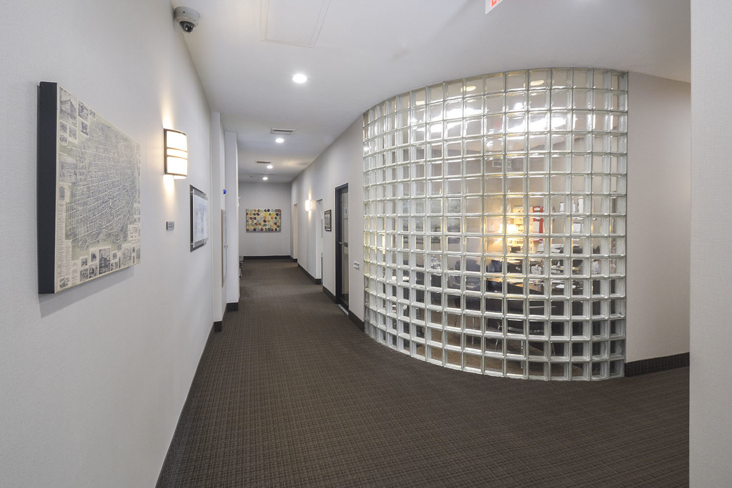main lobby and leasing office behind glass block wall