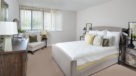 spacious bedroom with wall to wall carpet 