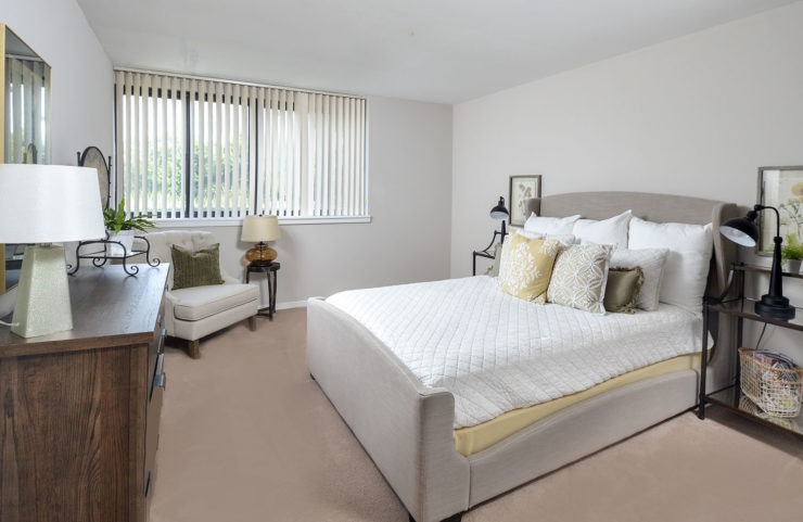 spacious bedroom with wall to wall carpet 