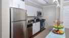 open kitchen with island and stainless steel appliances