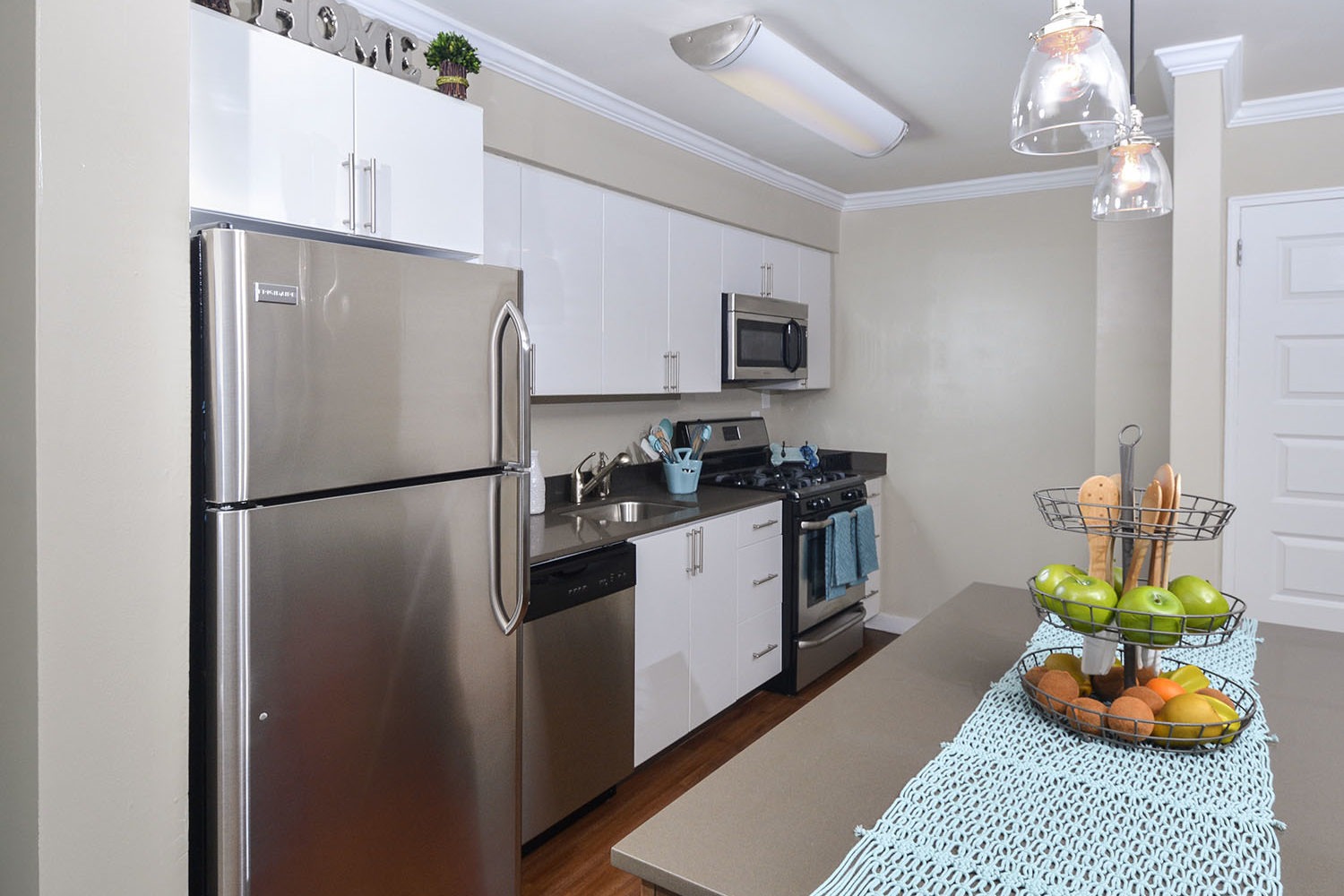 open kitchen with island and stainless steel appliances