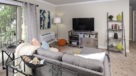 carpeted living room with sliding door to balcony