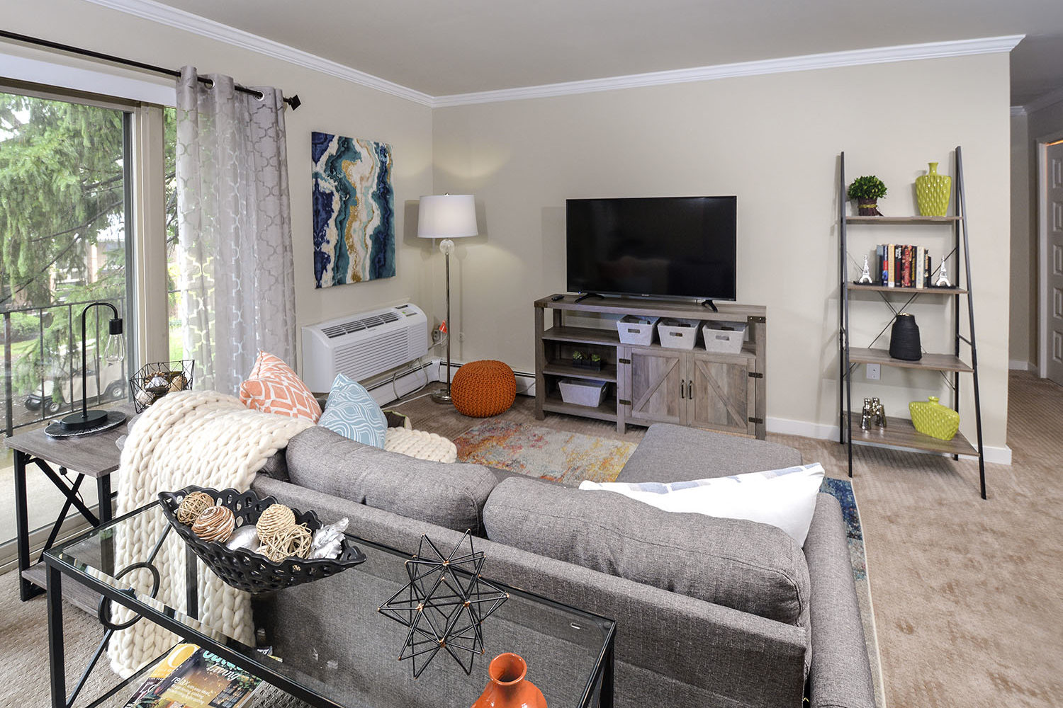carpeted living room with sliding door to balcony