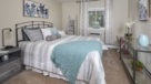 large bedroom with large window 