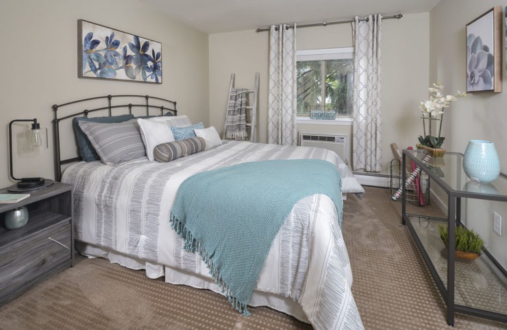 large bedroom with large window 