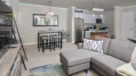living room open to dining area and kitchen