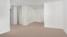 front door to apartment with ample closet space 