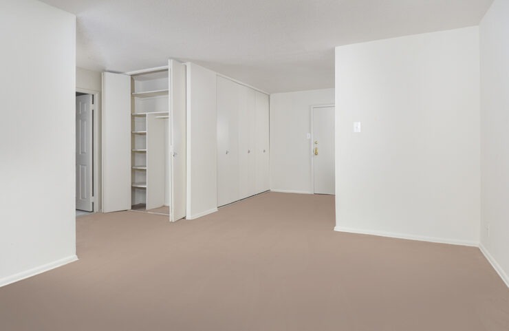 front door to apartment with ample closet space 