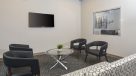 leasing office with sofa, chairs and flat screen TV