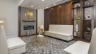 lobby with white seating area and fireplace