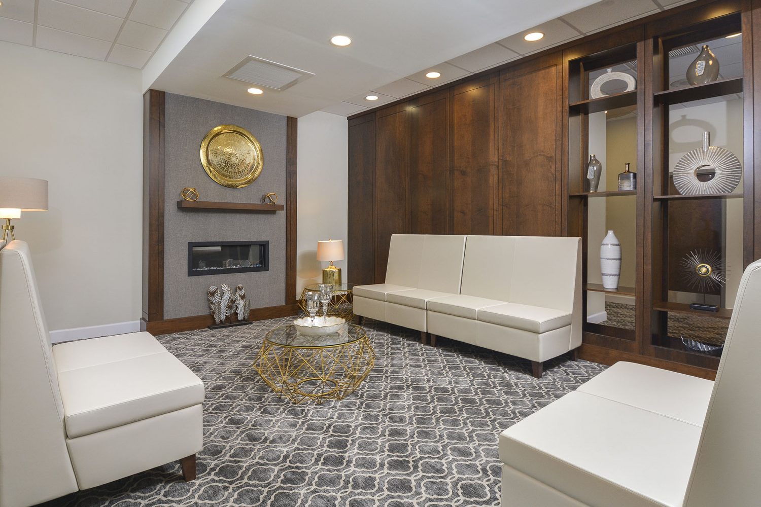 lobby with white seating area and fireplace