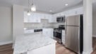 Penthouse Kitchen with Island and pendant lighting