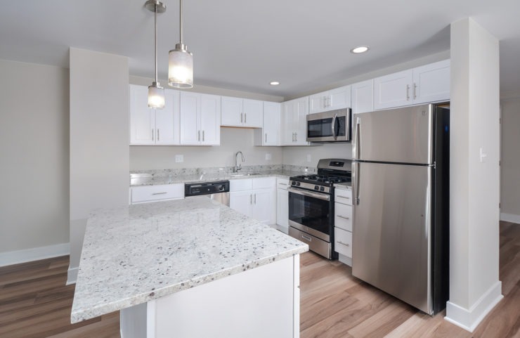 Penthouse Kitchen with Island and pendant lighting