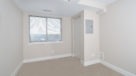 Penthouse bedroom with wall to wall carpets and large window to enjoy the view