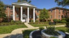 exterior with walking paths and landscaping