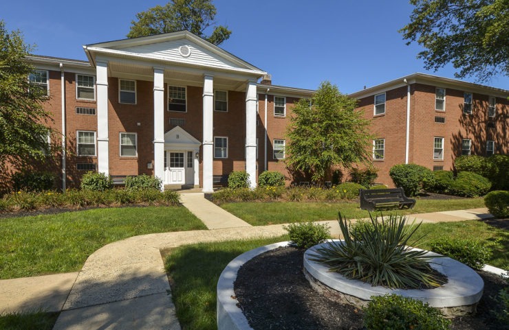 exterior with walking paths and landscaping