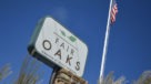 tall fair oaks sign with flag pole behind