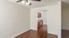 Dining Room with hardwood floors right outside kitchen