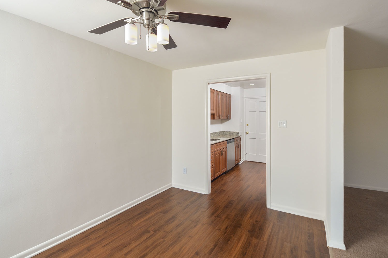 Dining Room with hardwood floors right outside kitchen