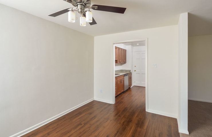 Dining Room with hardwood floors right outside kitchen