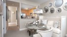 dining area just outside the kitchen with pass-through opening