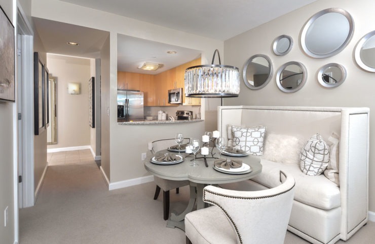 dining area just outside the kitchen with pass-through opening
