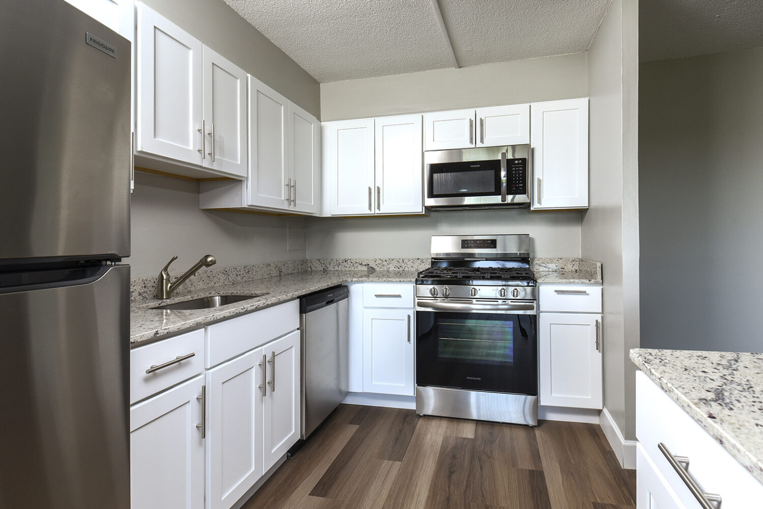 kitchen with white cabinets and island