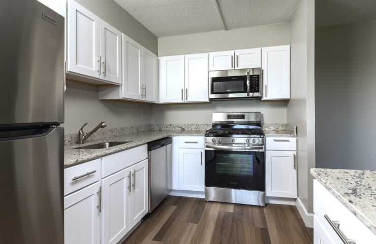 kitchen with white cabinets and island