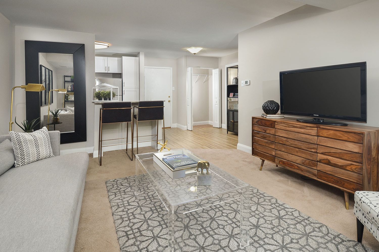 open kitchen into the living room seperated by a breakfast bar 