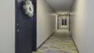 large bright hallway with entrances to apartments 