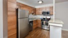 Updated kitchen with granite countertop and stainless steel appliancs 