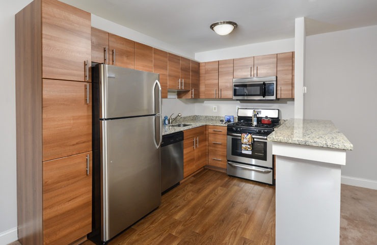 Updated kitchen with granite countertop and stainless steel appliancs 