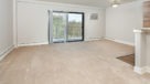 open living room with sliding doors to balcony
