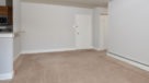 large living area with wall to wall carpeting