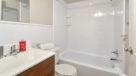 bathroom with white tile and cultured marble sink