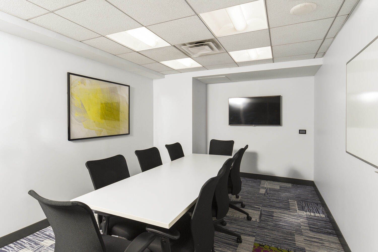 Conference Room with Large Table and Multi-Media Screen