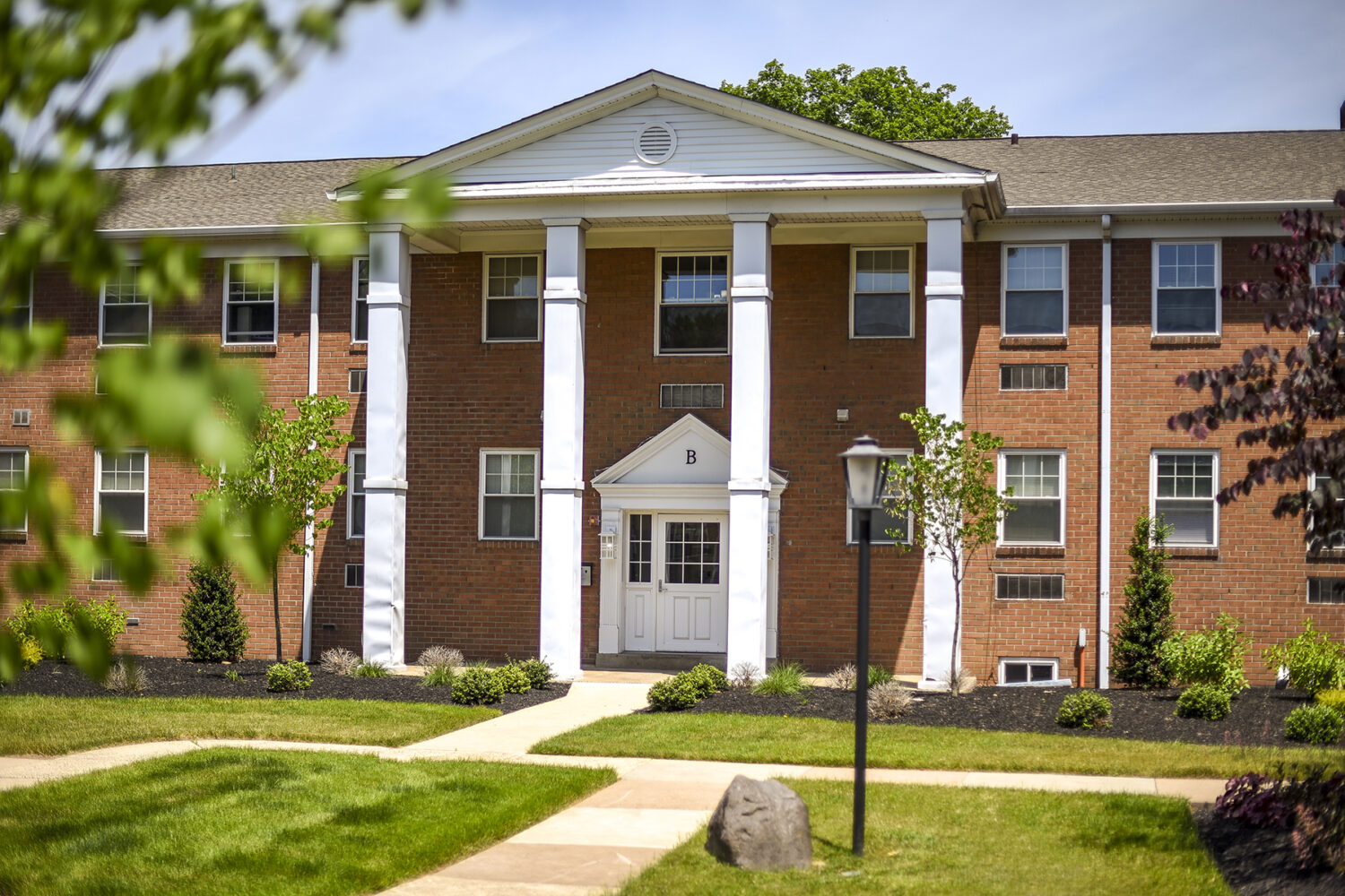 exterior with walking paths and landscaping